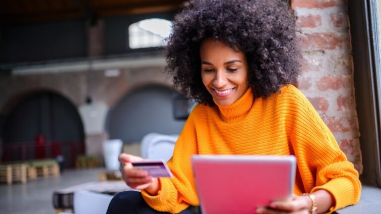Woman applying kronosshort global journal perks programme promo code on tablet